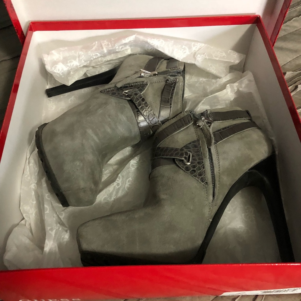 Grey strappy ankle boots.